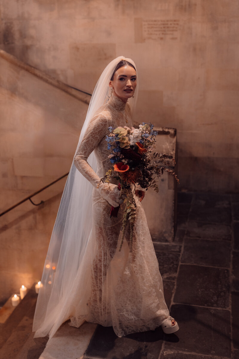 Wedding photographer captures couple taking a stroll hand in hand at their french chateau wedding.