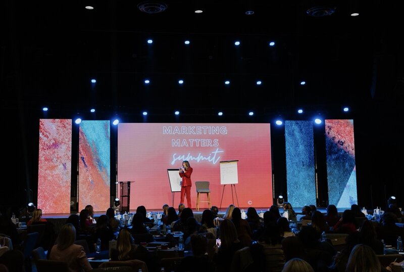 Macy McNeely speaking on stage