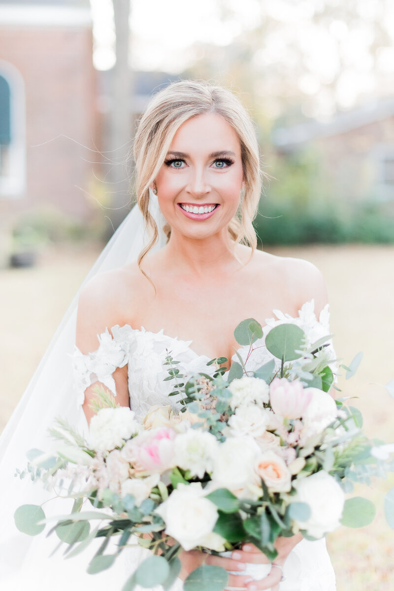 Bright & airy shot of bride holding bouquet in Louisiana