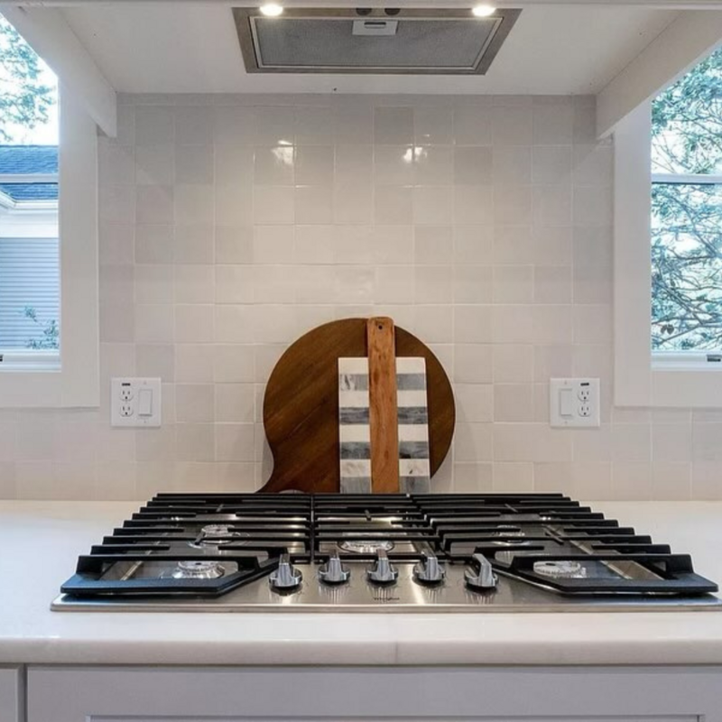 White backsplash tile in a kitchen.