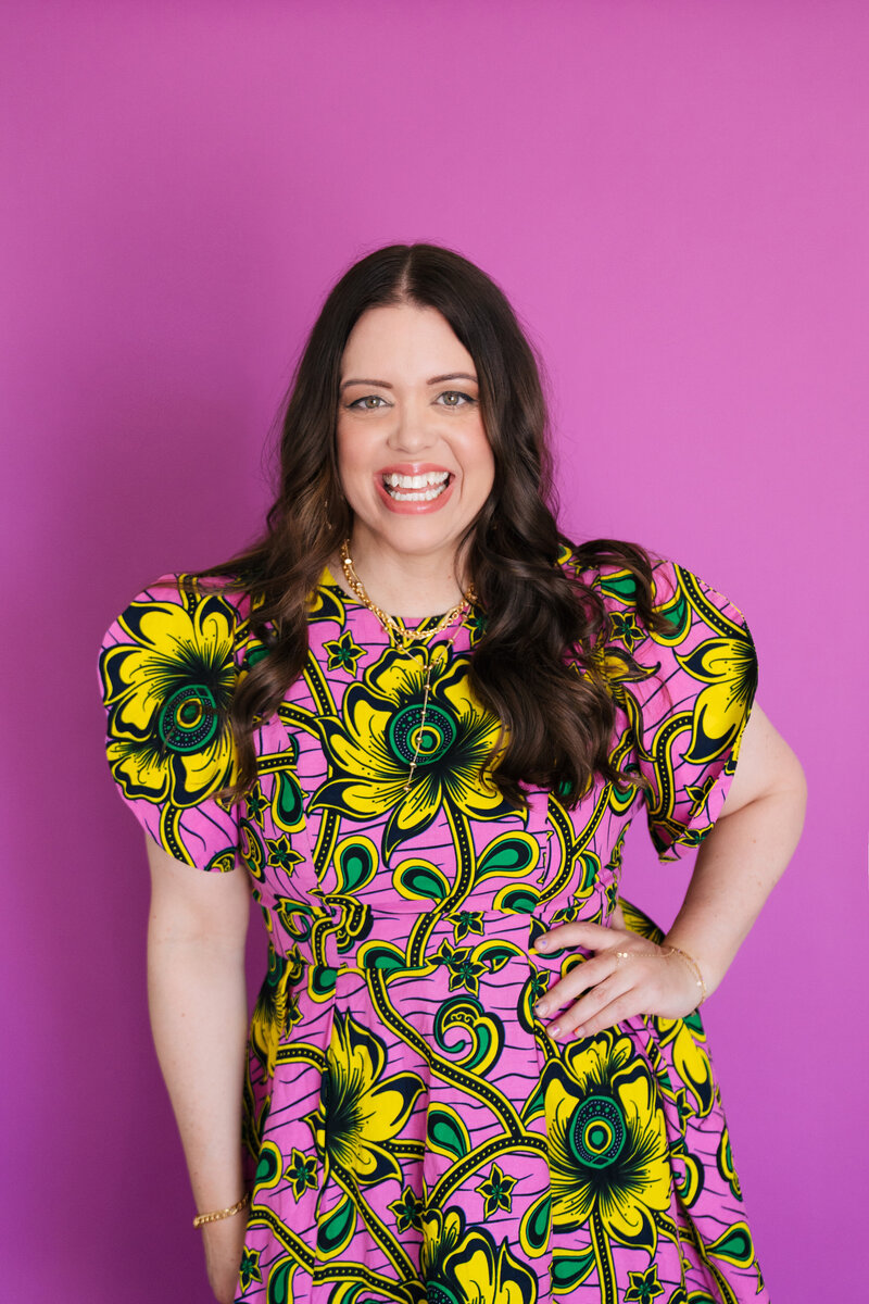 heather smiling in pink and yellow dress