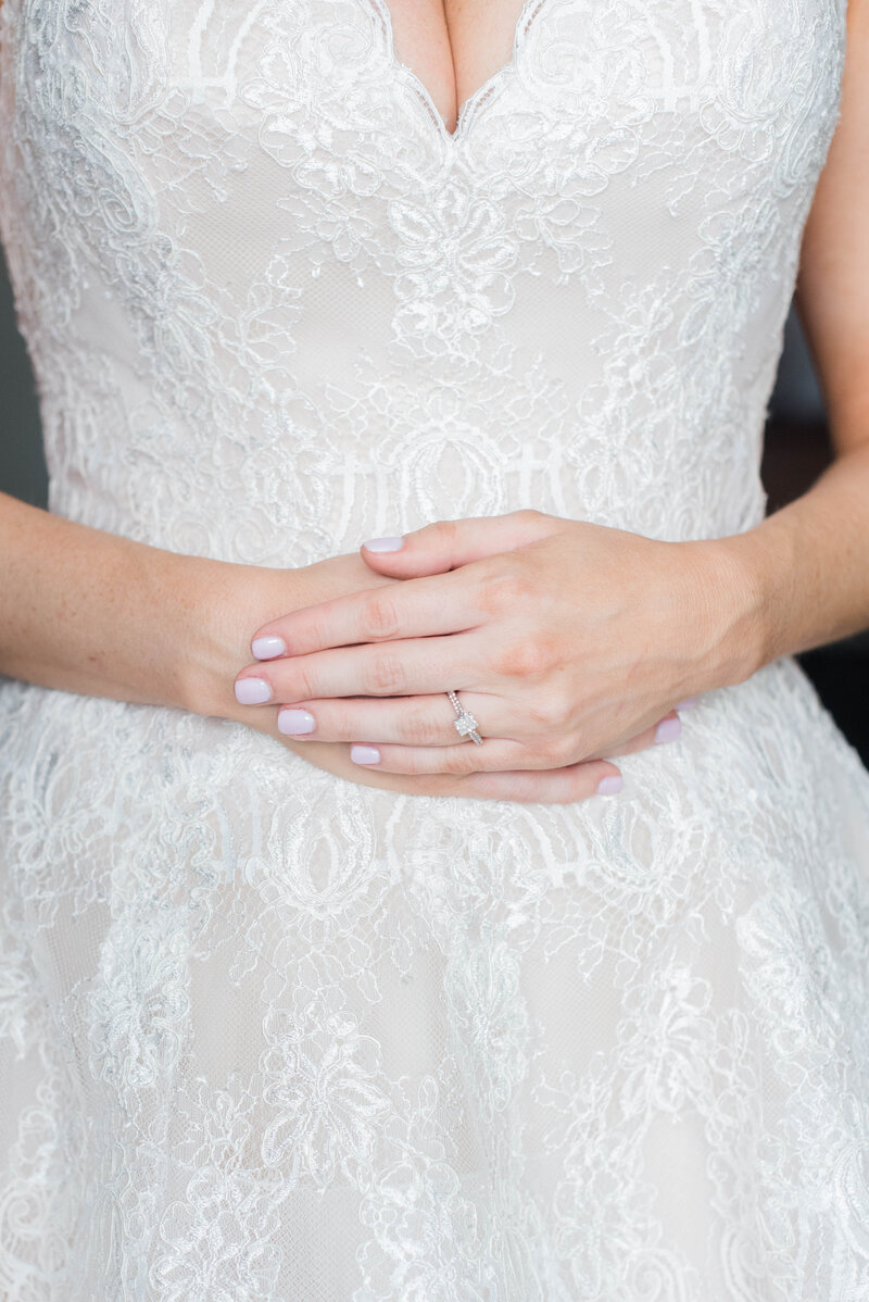detail of bride's dress and ring