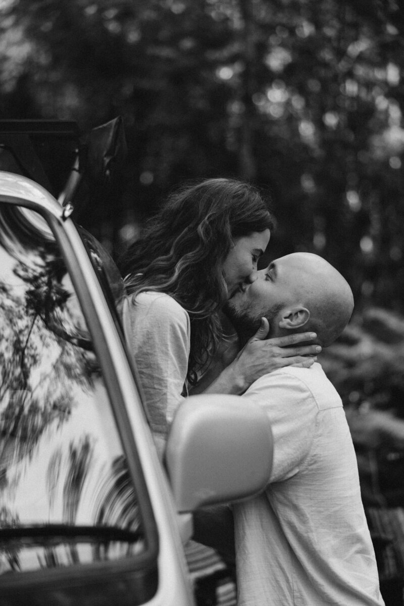 black and white image of a couple eloping in picturesque landscape by Elopement photographer