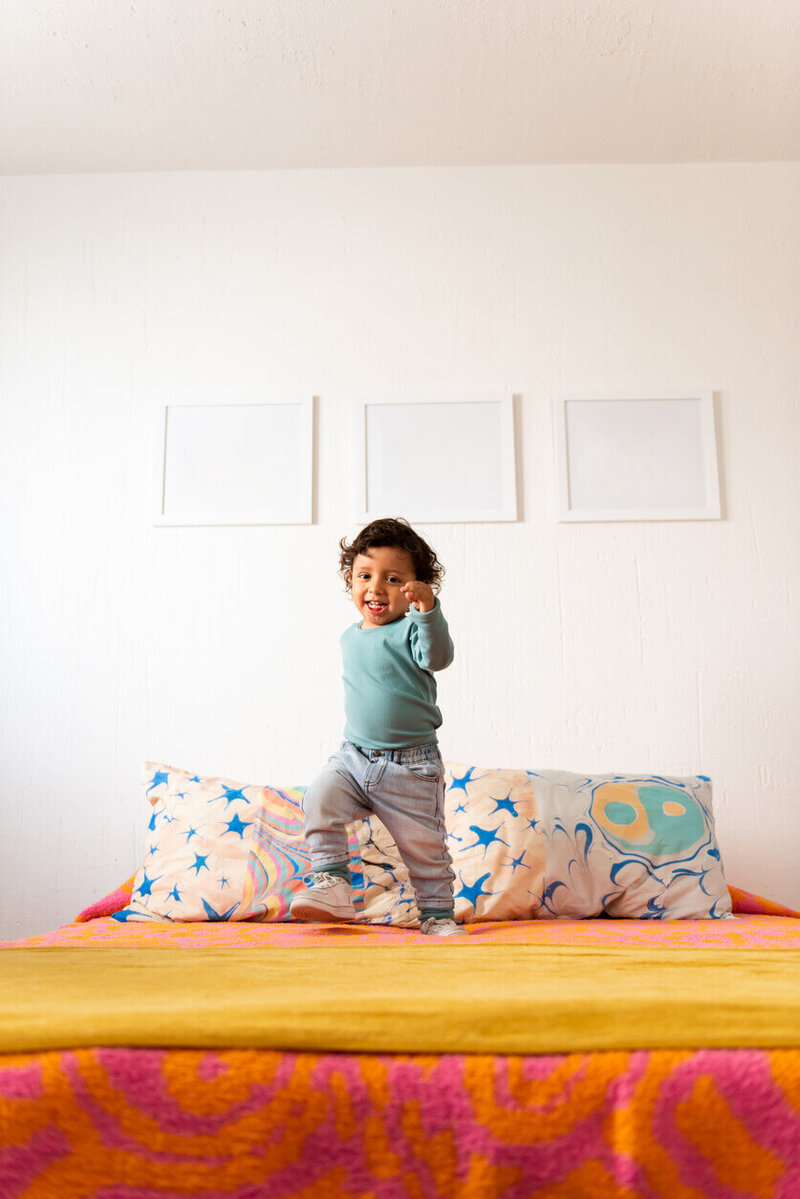 Happy baby on bed