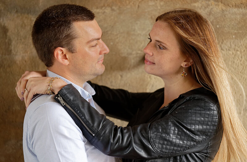 engaged couple looking into each other's eyes