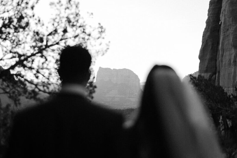 black and white image couple looking at mountains