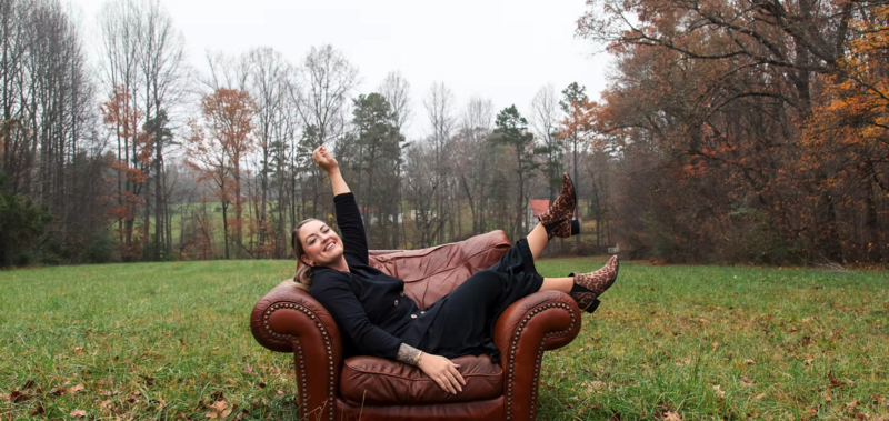 leather chair outdoors with woman sitting on it