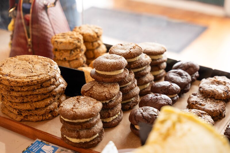 Stacks of gluten-free cookies on display at Grain Artisan Bakery & Café in Snohomish, WA — inviting customers to visit the café or find Grain’s pastries at local Seattle farmers markets.