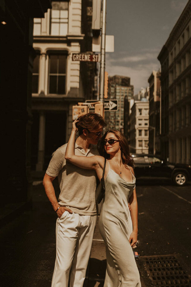 couple on street in intimate moment