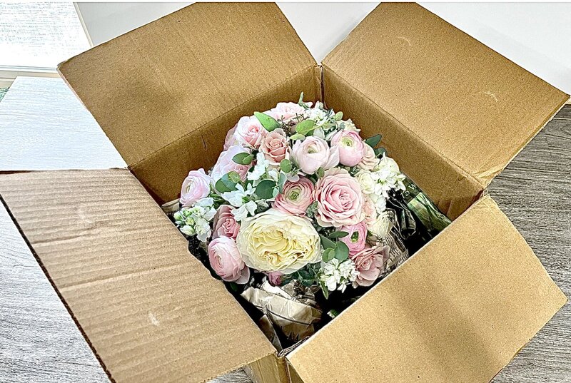 peach roses white tulips pink lizzyathus blue delphinium casket spray funeral flowers