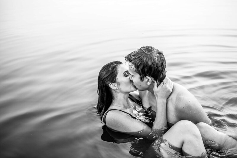couple kissing in a lake