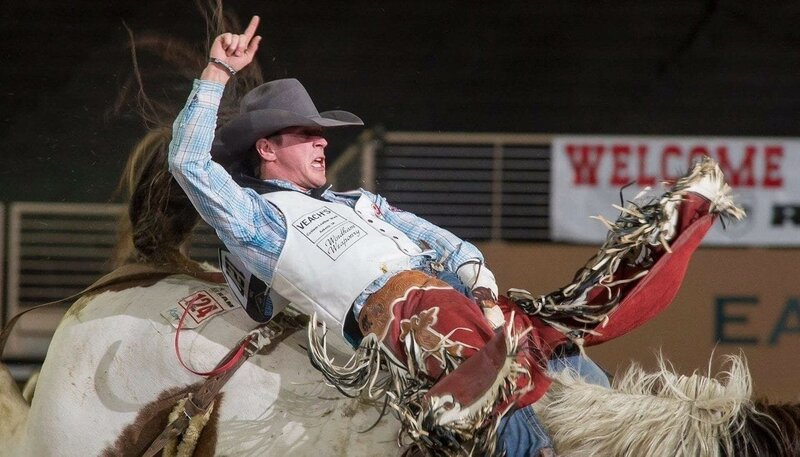 A bareback rider on a  horse during a rodeo with rodeo elbow braces, a device that provide robust support to enhance performance with durability and comfort.
