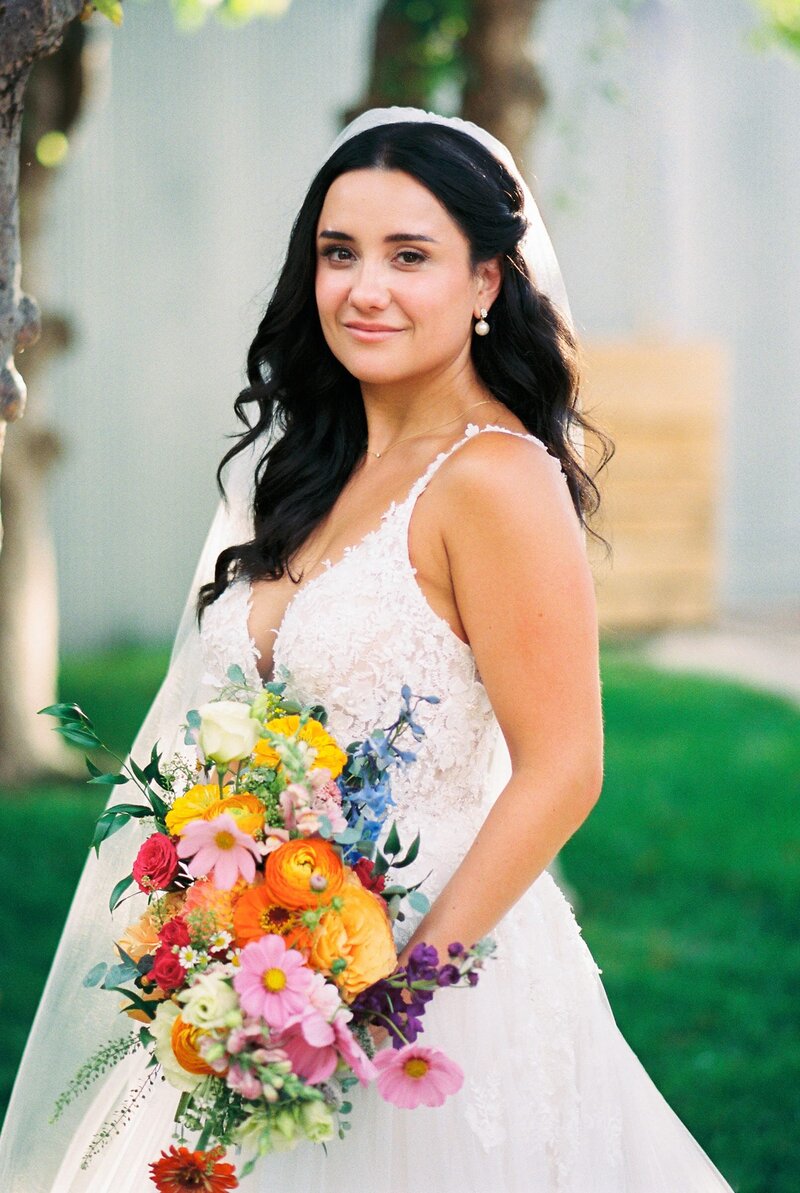 bride holding floral bouquet