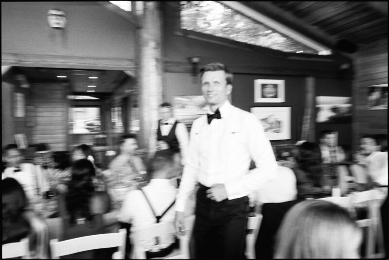 35mm film photo of groom at his wedding reception