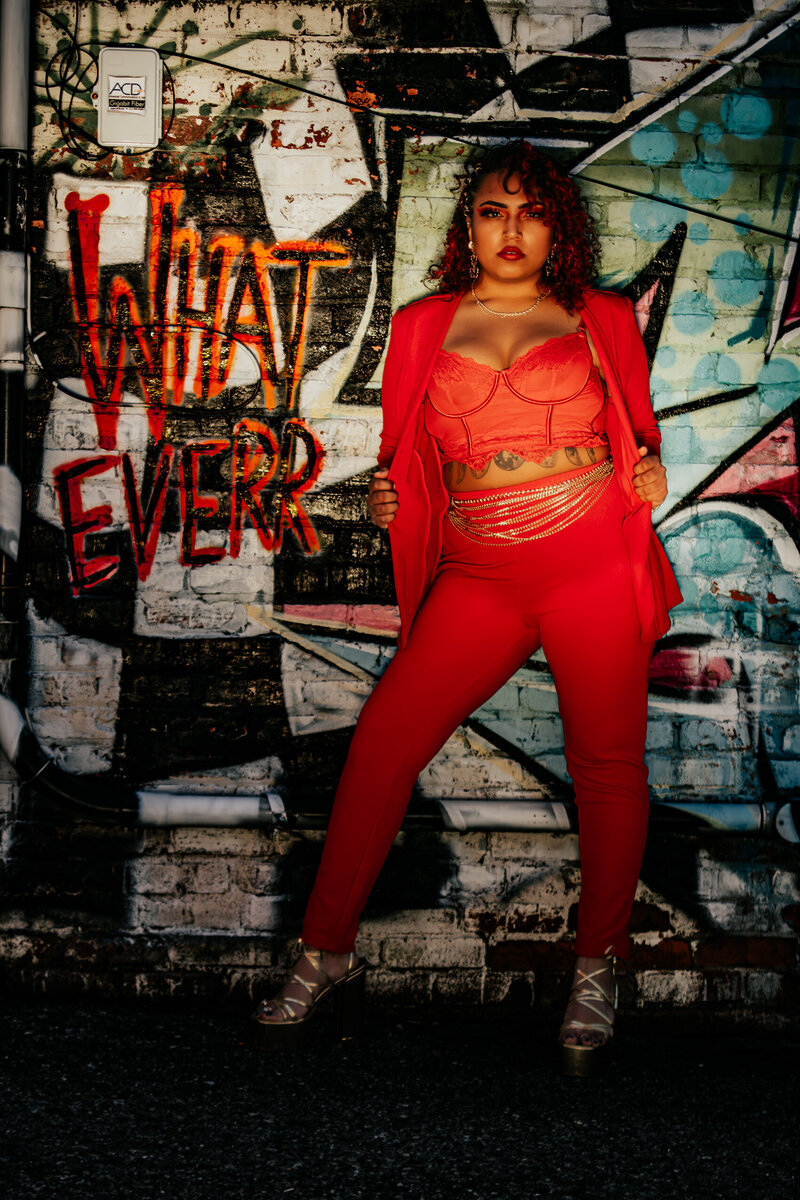 Creative portrait with lighting and bold, editorial fashion styling in Old Town Lansing, Michigan.