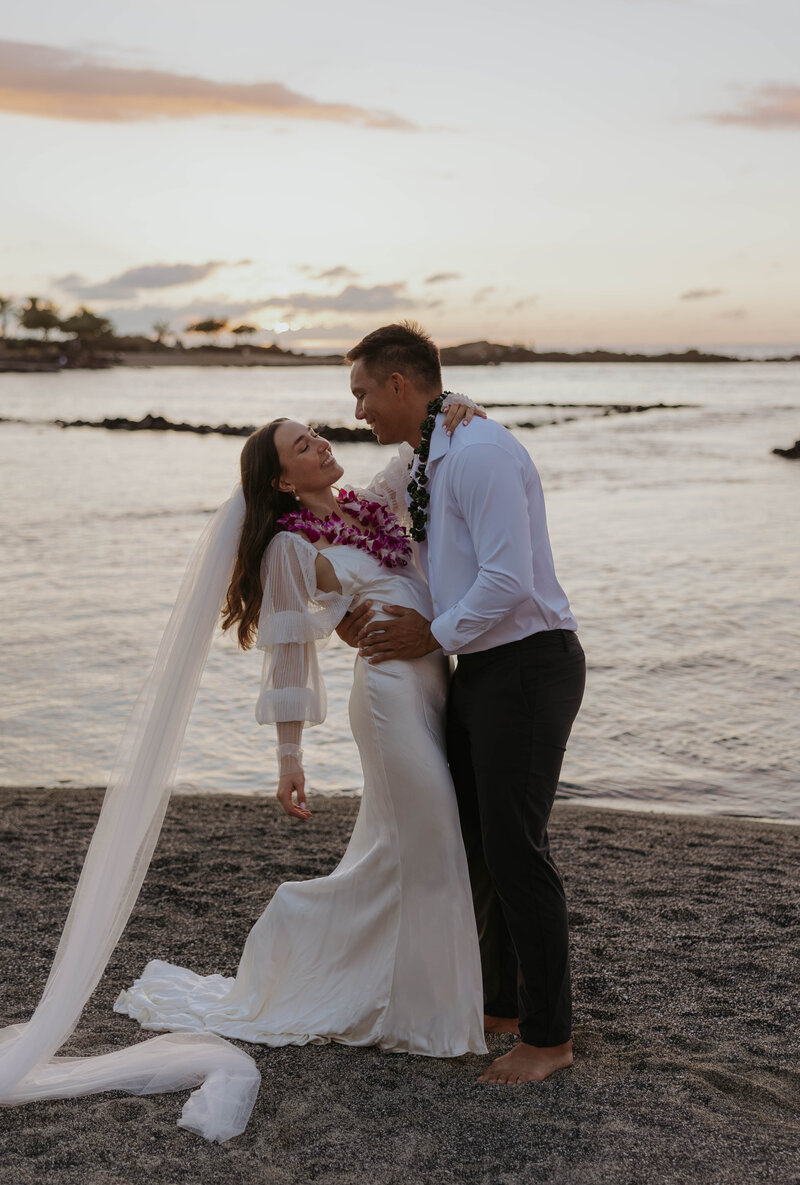 destination wedding photography in Hawaii bride and groom eloping during sunset on the beach