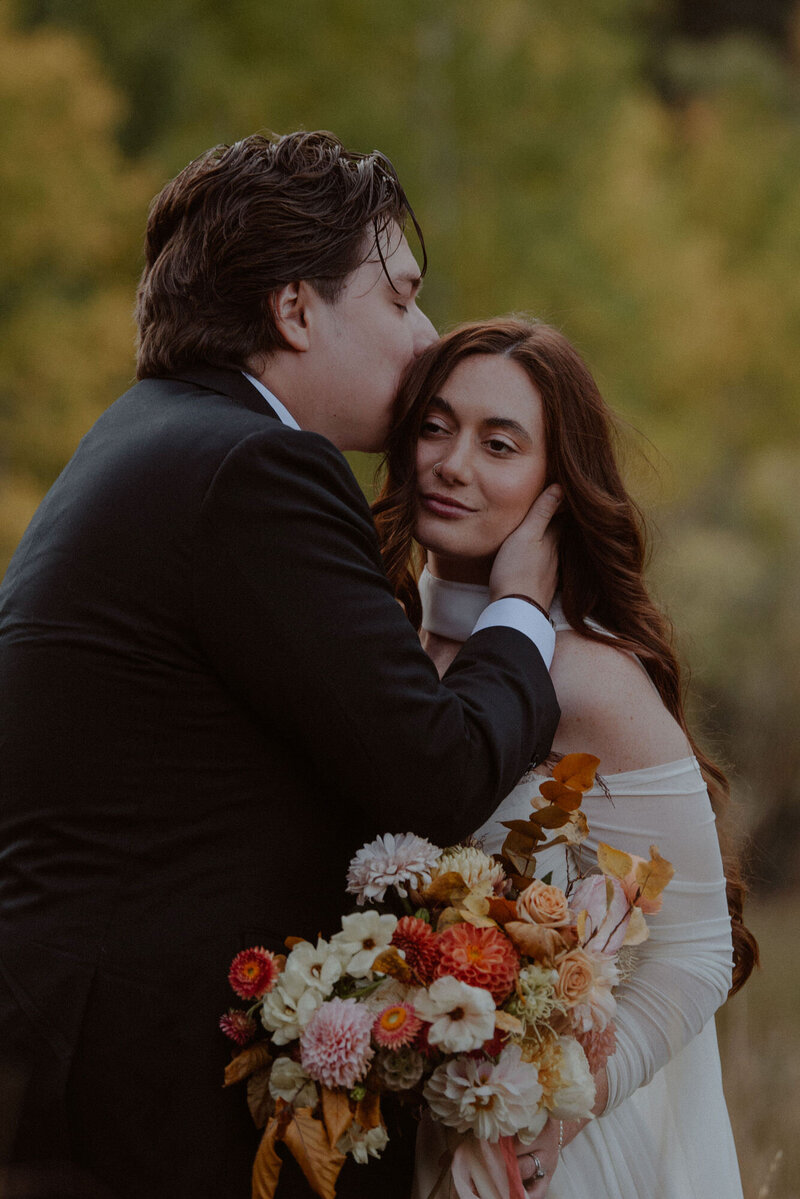 Bride holds bouquet in her hand