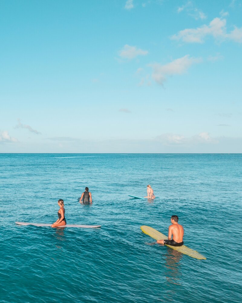 A group of beginners listening to their instructor