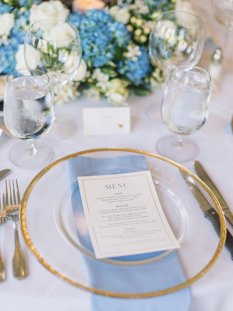 modern bride reception place setting in white pale blue and gold