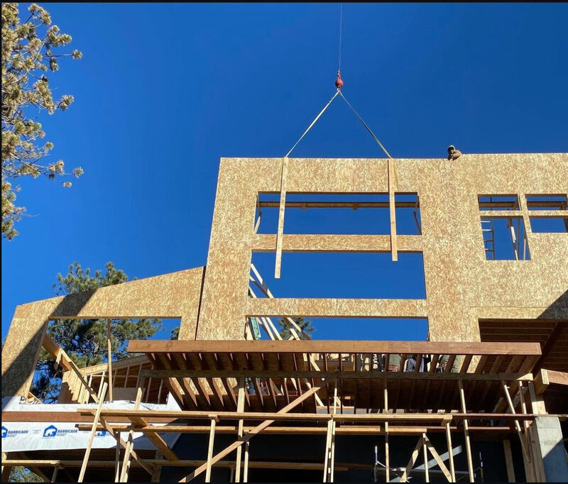 Crane-assisted beam installation in Colorado foothills