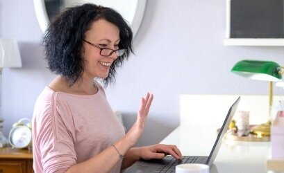 Woman enjoying a retirement coaching session online.