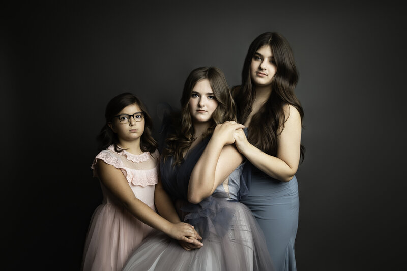 Maternity family session kids running around mom in open field