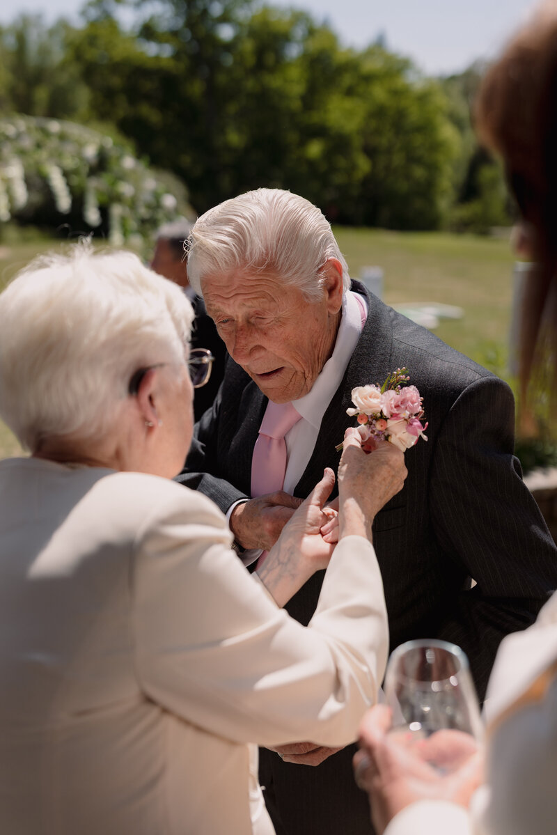 Wedding photographer captures couple taking a stroll hand in hand at their french chateau wedding.