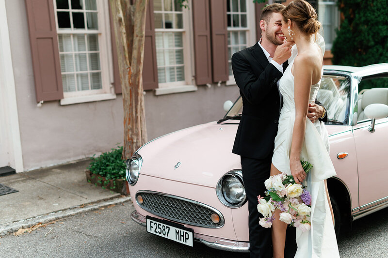couple kissing by getaway car at Laguna Gloria 