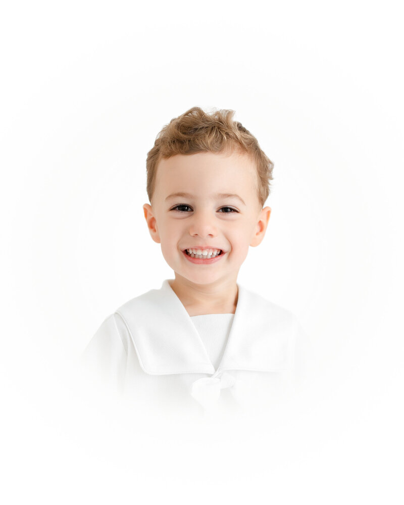 A sweet boy smiling at the camera during his Vignette Photos with Jessica Green Photography