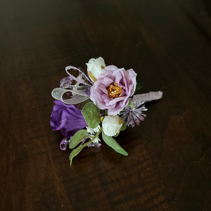 Purple and yellow faux floral corsage