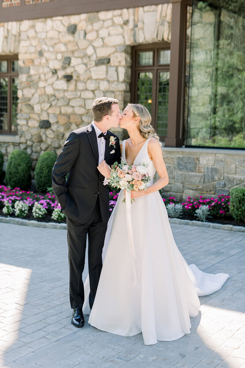 bride and groom kissing