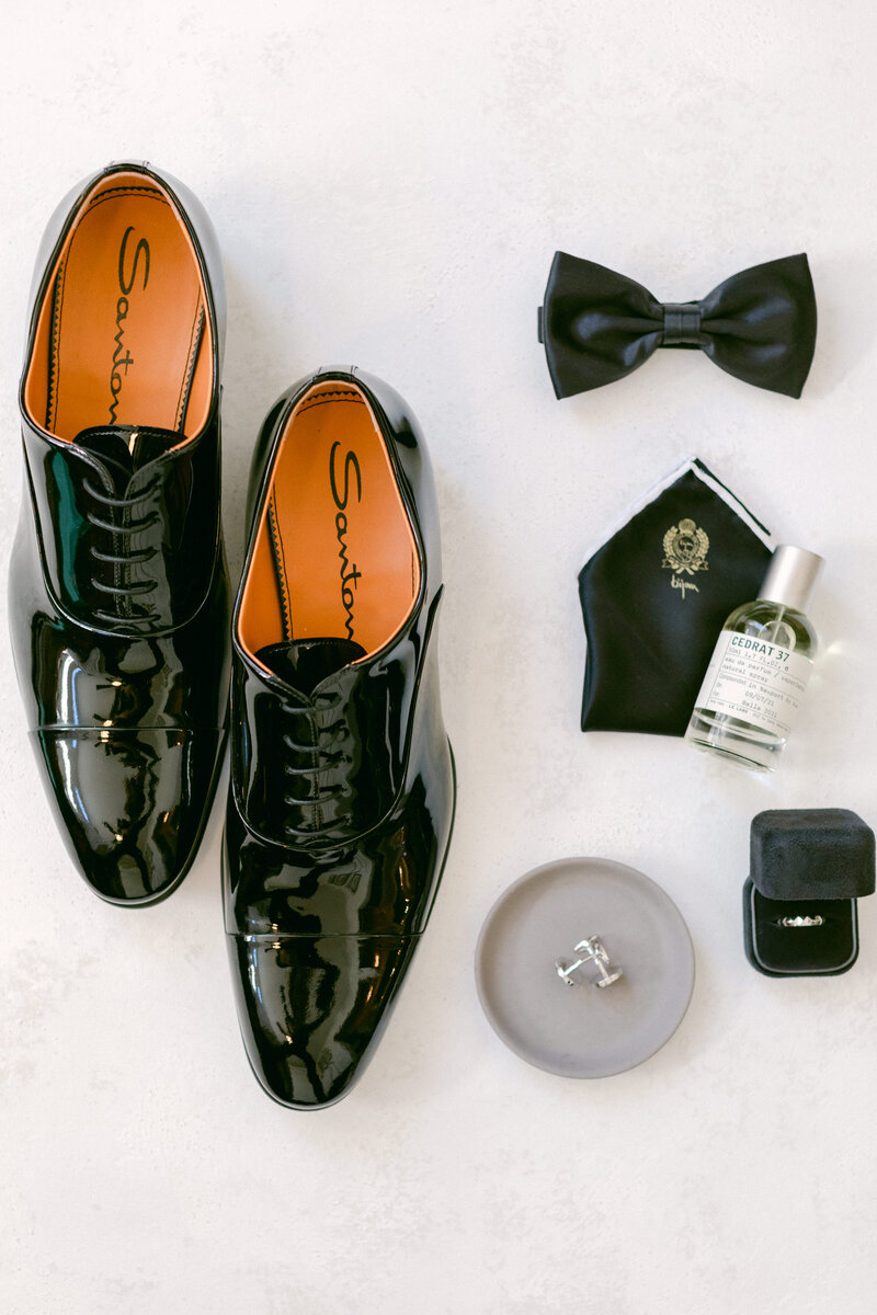 Flatlay of groom's accessories for his wedding day