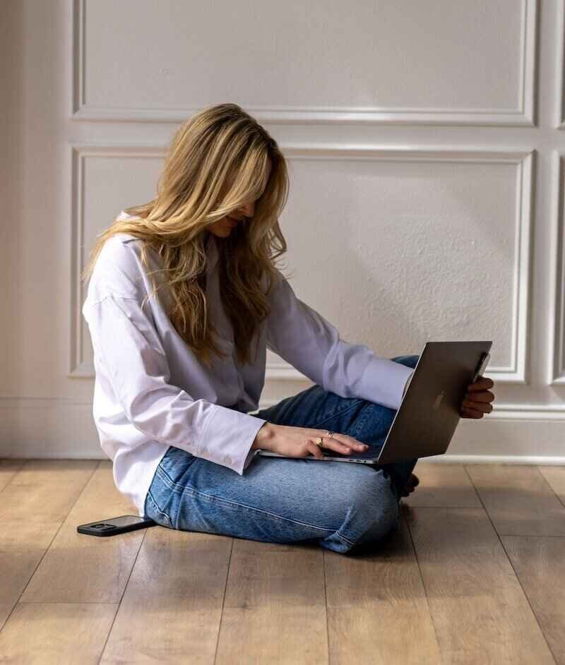 merrit elizabeth working on laptop