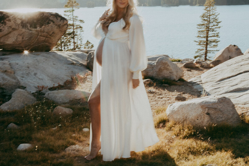 woman  standing near mountains in field