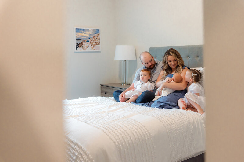 Family of  5 welcoming baby boy into their family at her home session in Savannah, ga