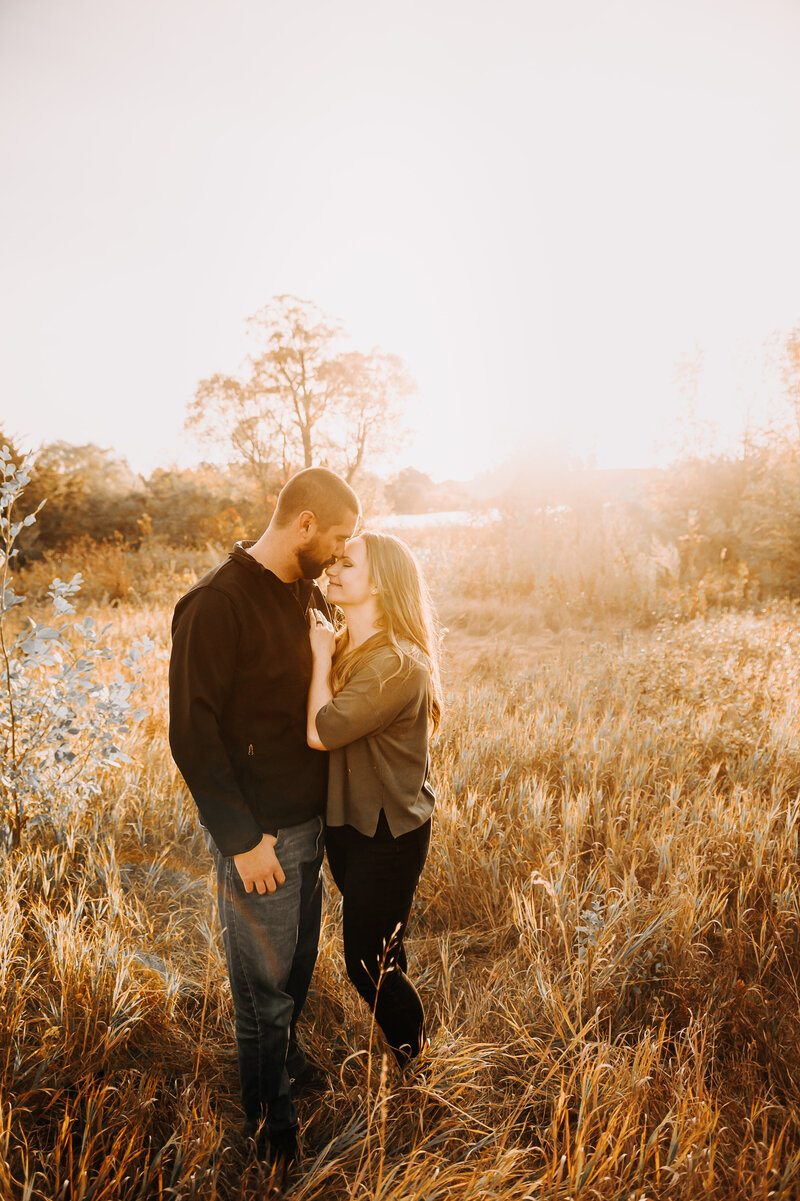 With littles running around sometimes we forget to stop and take in the two people who started it all. With a family session at Sweet Briar lake, ND, a quiet moment between mom and dad is perfectly captured in the sunrise. 