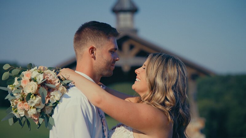 A happy bride smiling at her groom in a Pennsylvania farmhouse wedding film - Films by Brian