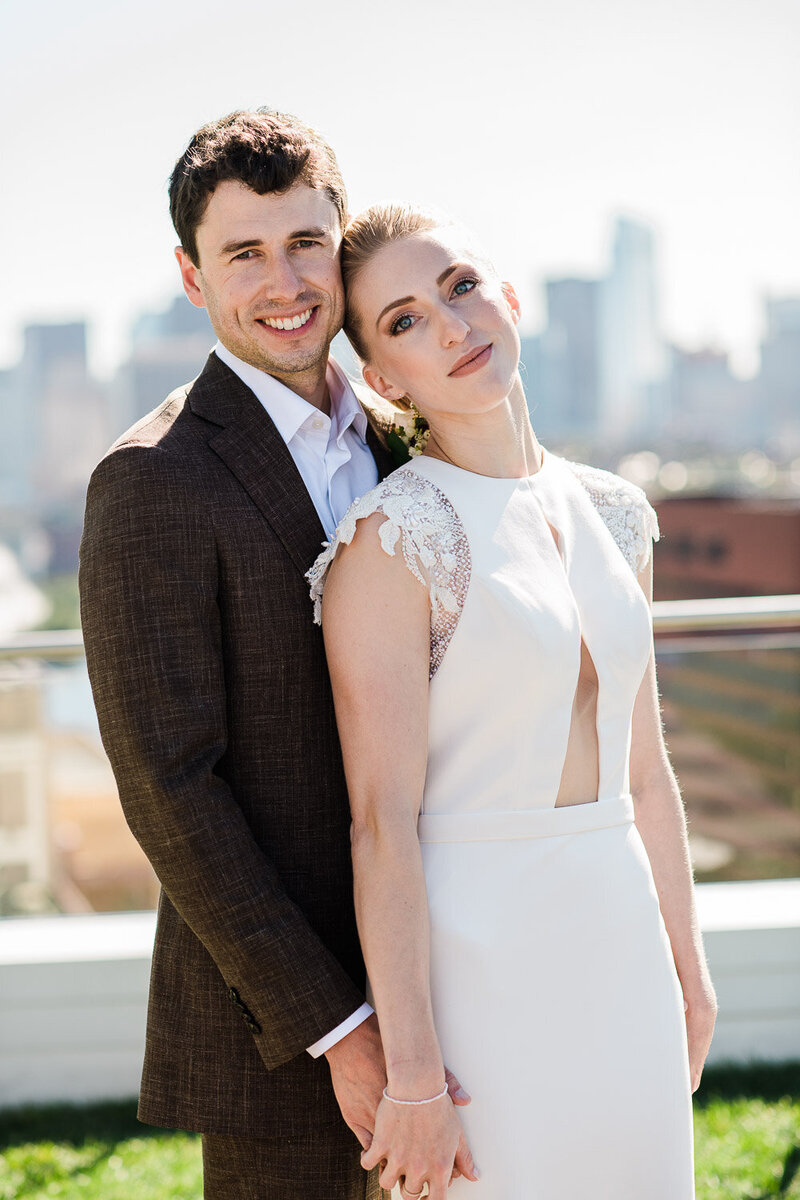 bride and groom portrait on rooftop in Boston