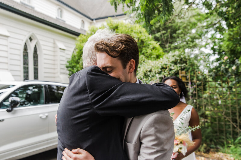 groom and his dad hugging