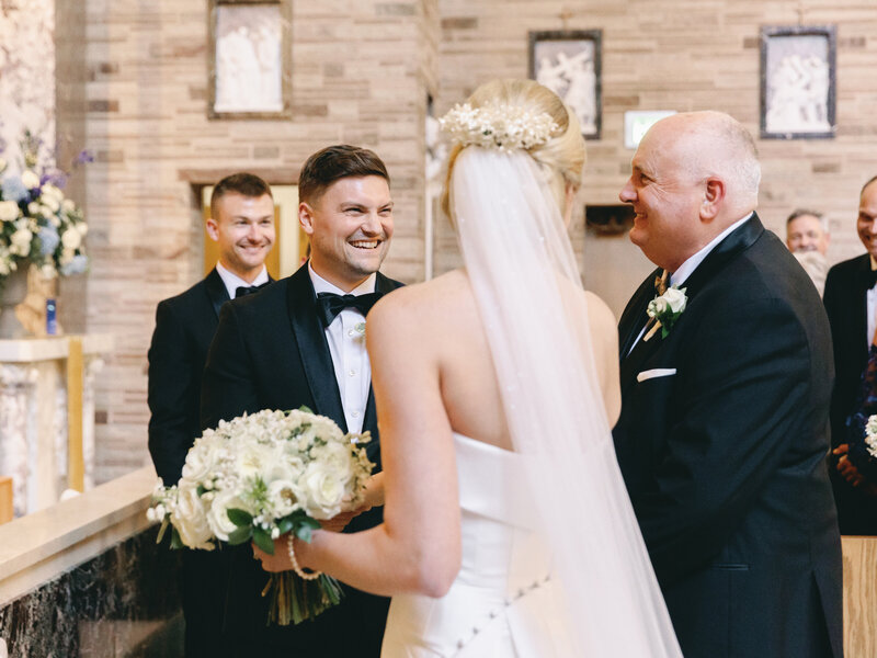 modern bride with her groom and father of the bride while wearing her Grandma's vintage heirloom wax flower hair comb