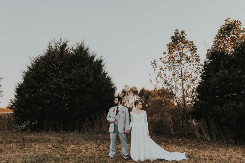 couple standing in field