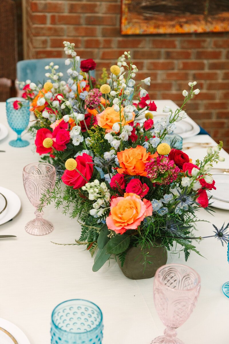 Orange and red flowers on wedding table