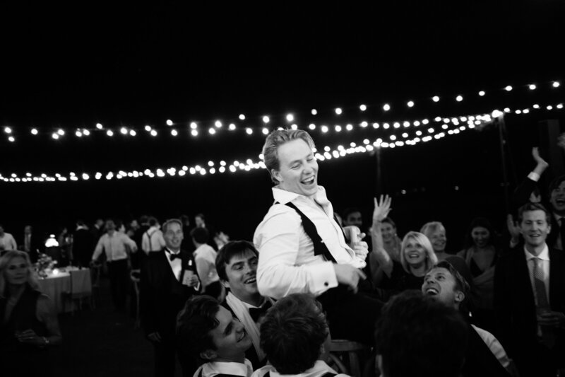 bridal party holding each other