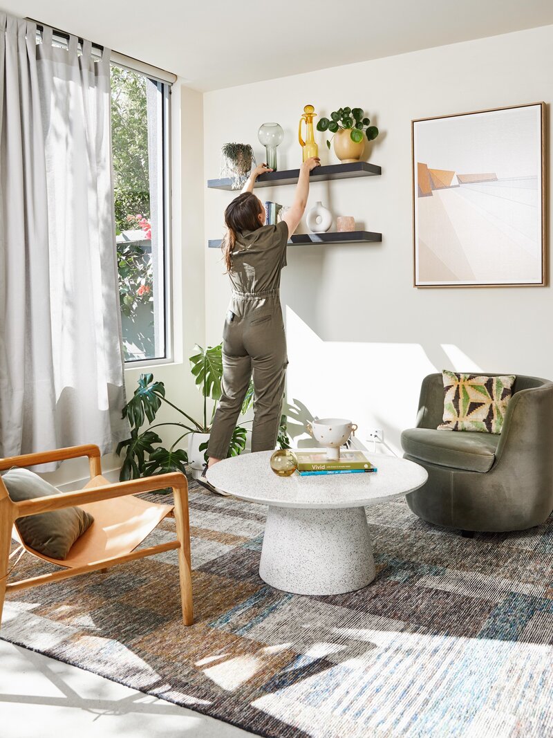 Living room interior design with modern shelving, statement artwork, and styled decor by Lisa Hunter Interiors – Caulfield Melbourne interior designer