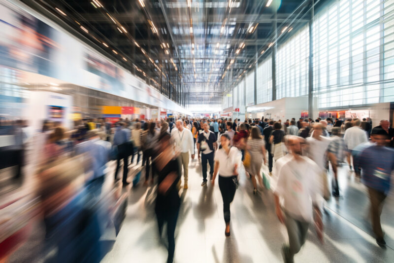 Large building with blurred out attendees