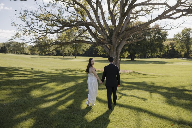 bride and groom portraits in grass