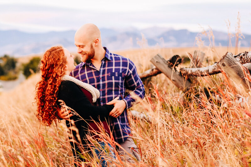Couple's portrait in field