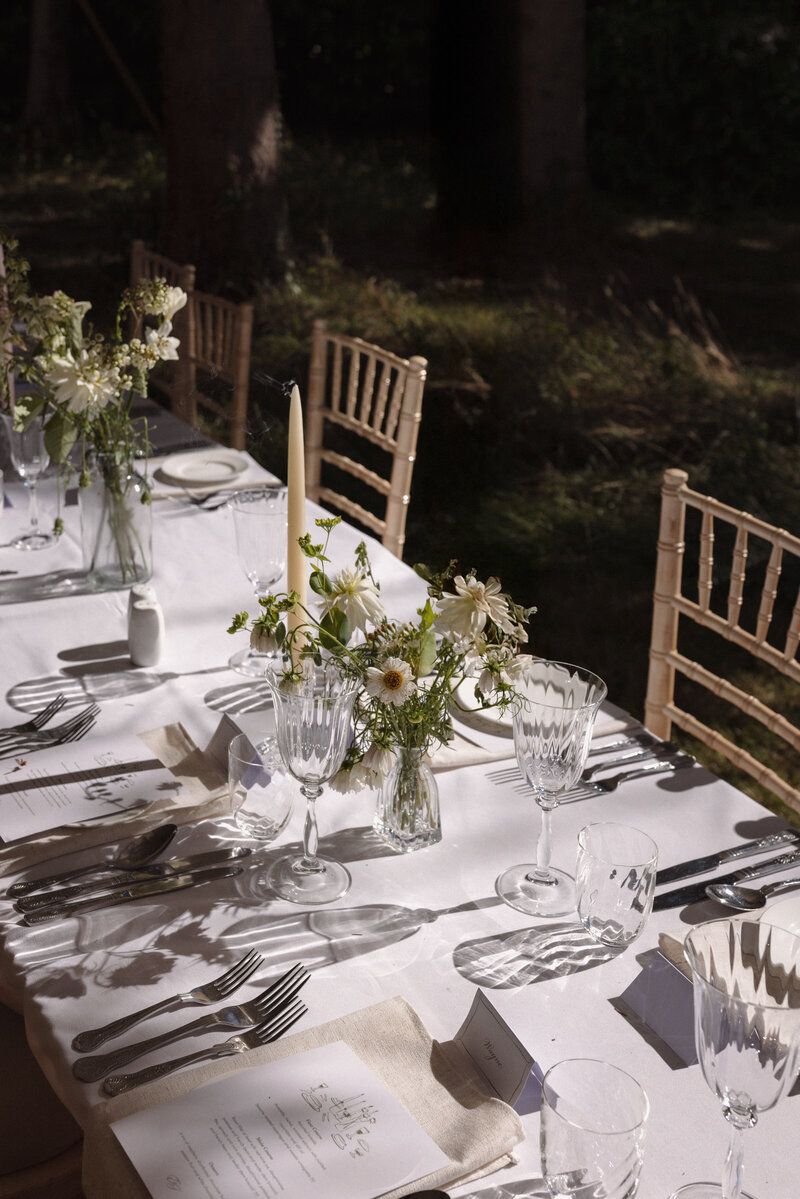 Wedding photographer captures couple taking a stroll hand in hand at their french chateau wedding.
