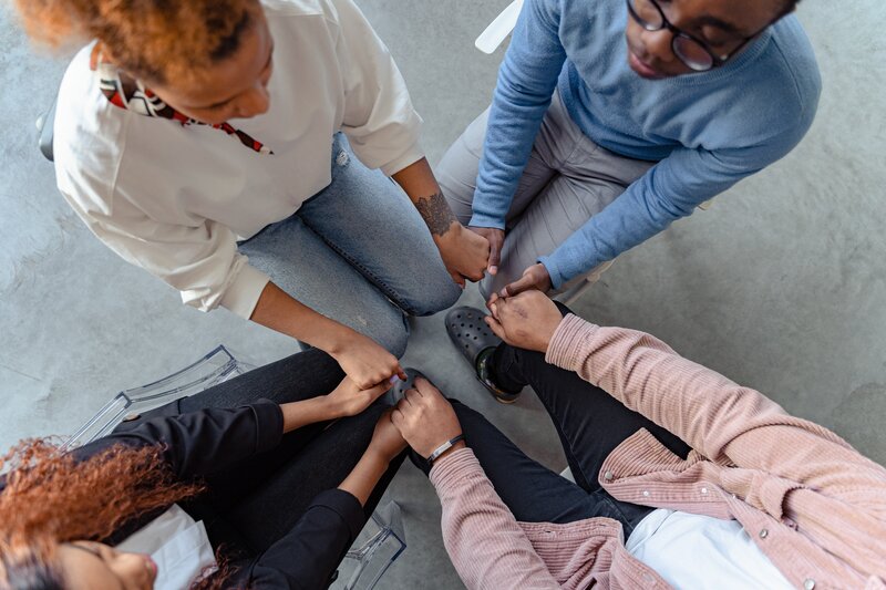 Group joining hands