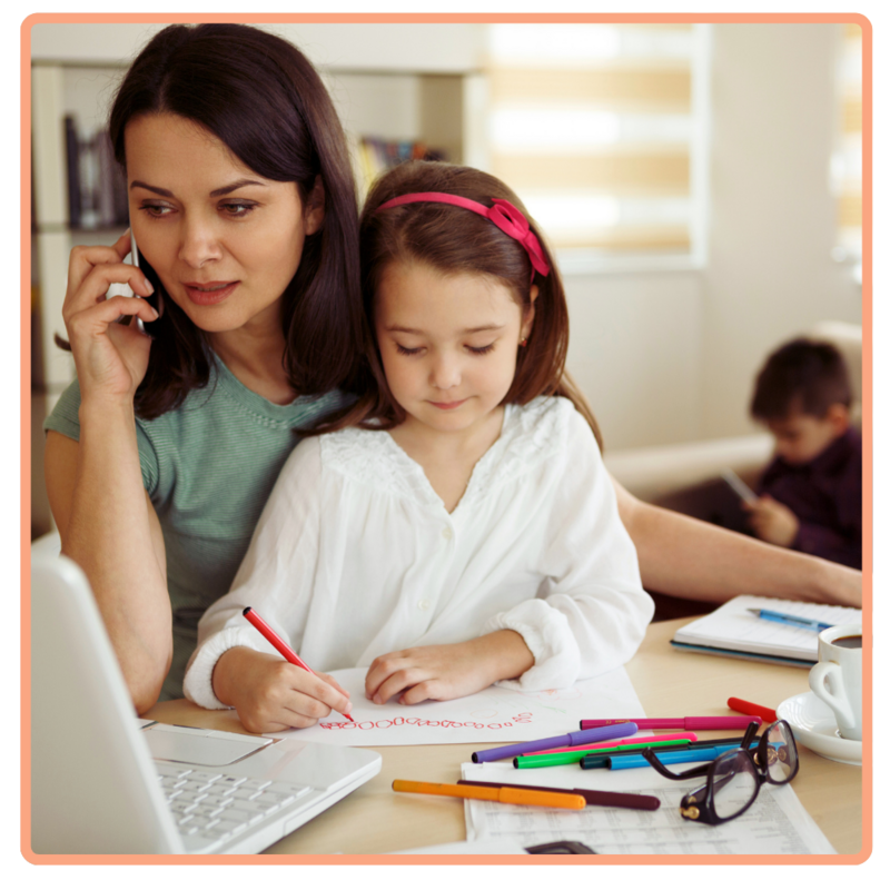 Mother working on the phone with daughter in her lap and son playing in the background